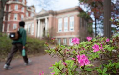 Student walking by Tech Tower.